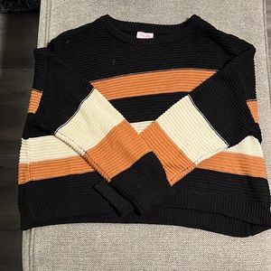 Black, tan, white sweater